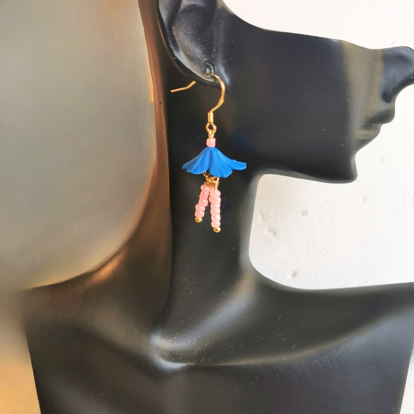 Blue flower earrings with pink dangling stems